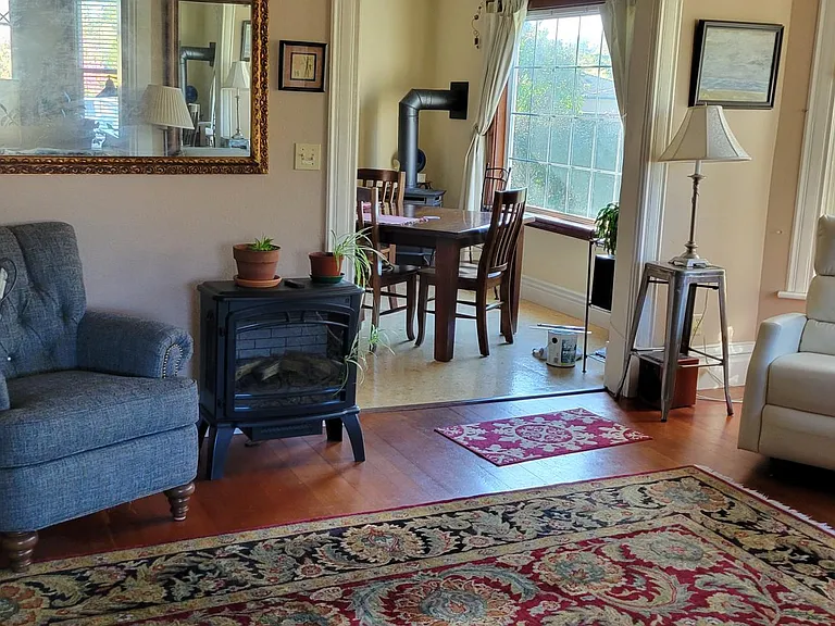 Living room electric stove and chairs