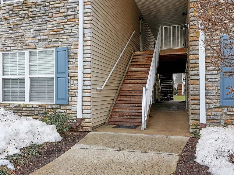 Second level access is in front of the parking area