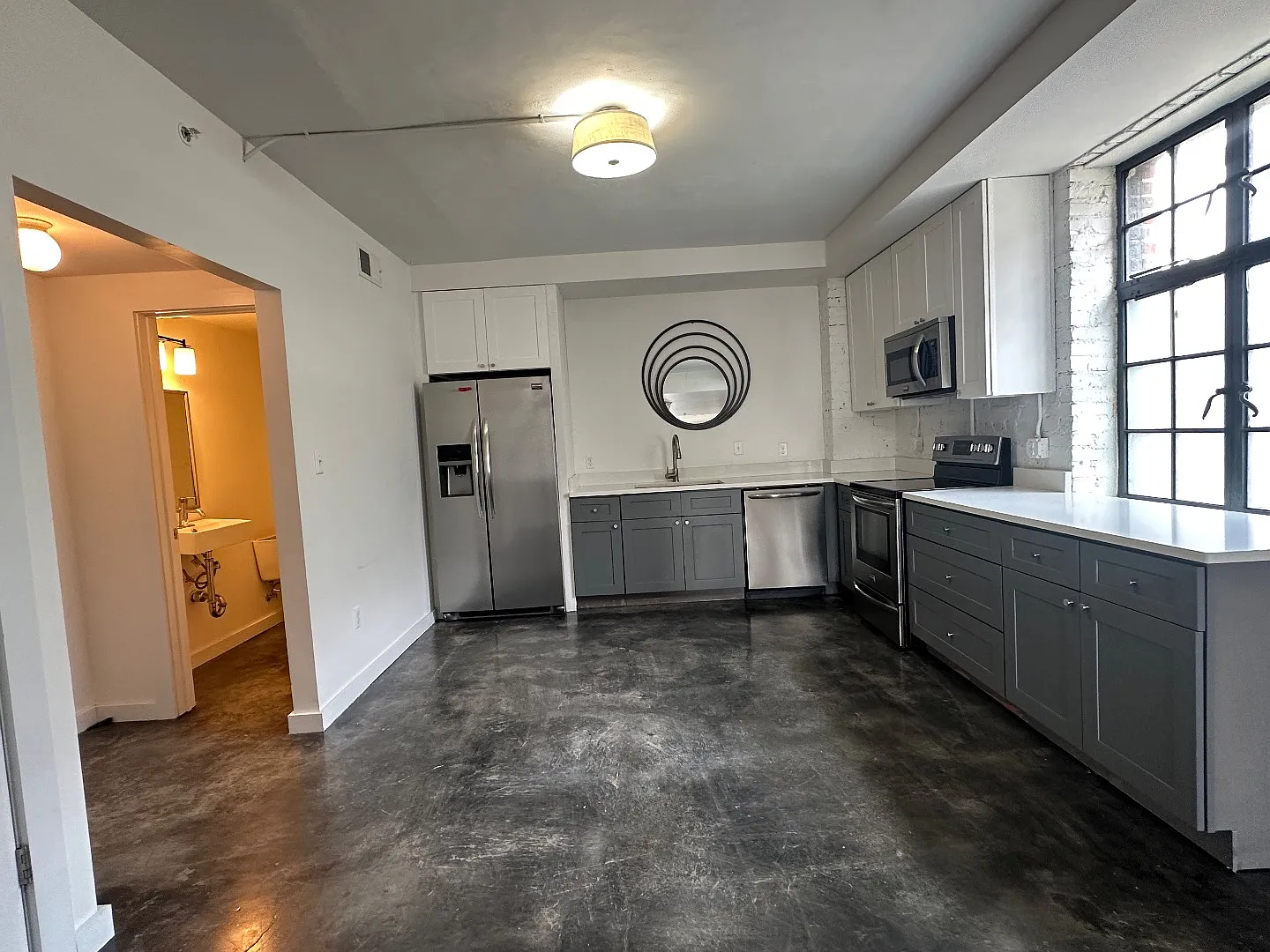 Industrial-Chic 2BR/2.5BA with Rooftop Views + Off-Street Parking in Historic Algiers Point — Photo 2