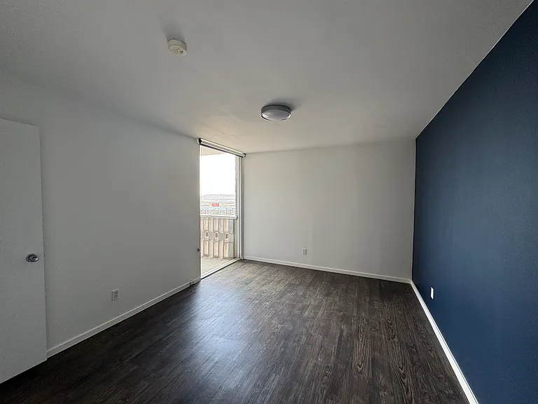 Bedroom features insulated exterior wall for year round comfort, efficient LED lighting, new blackout roller shade, and a walk-in closet.