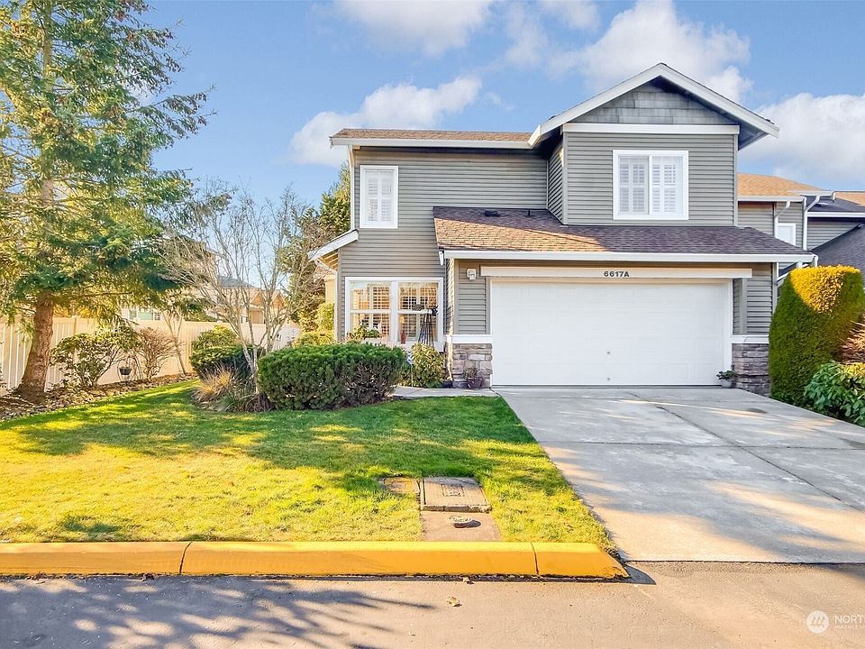 Wonderful home with your primary bedroom on the main floor. Perfect peaceful location with incredibly private backyard. This home is loaded with upgrades!>