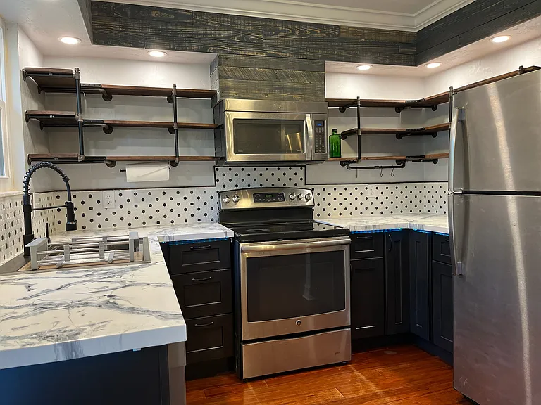 Kitchen with stainless steel appliances.