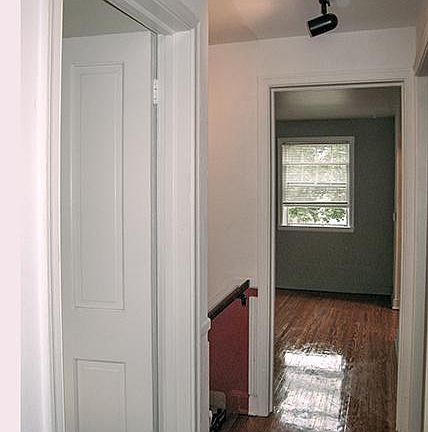 WALK THROUGH HALLWAY, TRACK LIGHTING, OAK HARDWOODS.