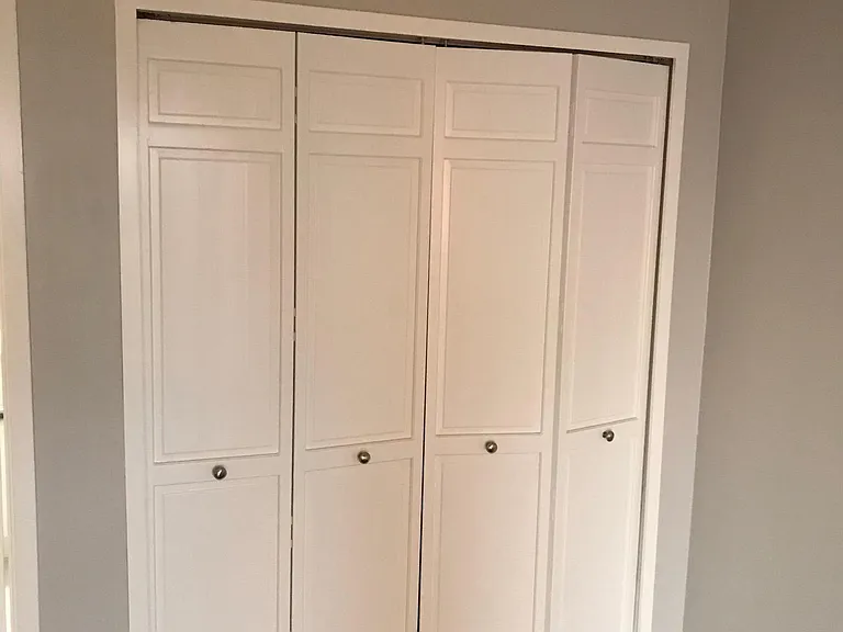 One of two large master bedroom closets.