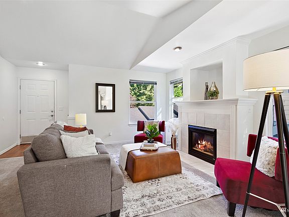 Main living with vaulted ceilings, lots of natural light and privacy too! >