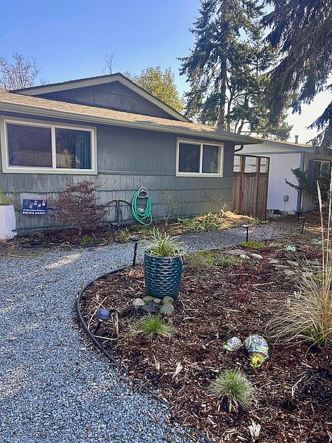 Front of house, gravel path way down to unit (around the side of the house and down)
