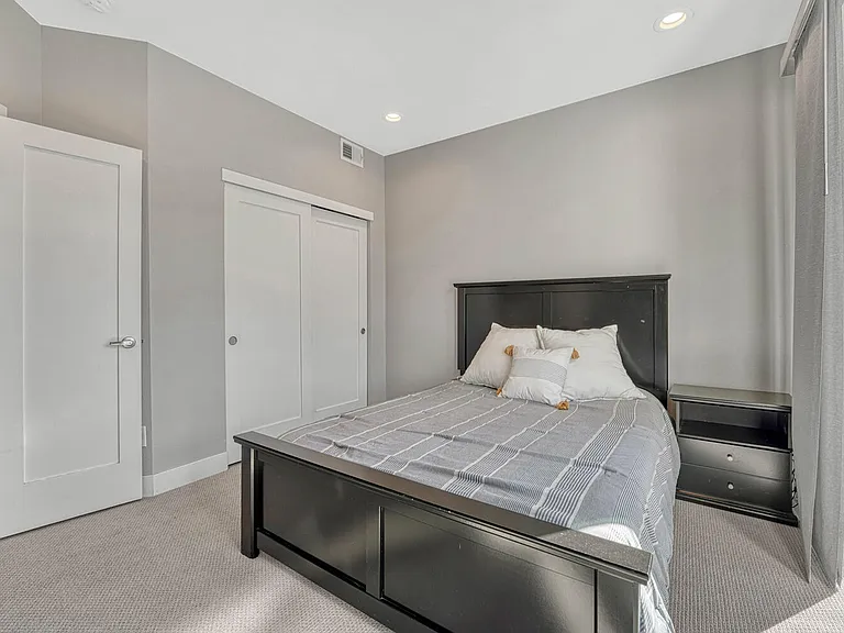 Bedroom with walk-out patio, entry level