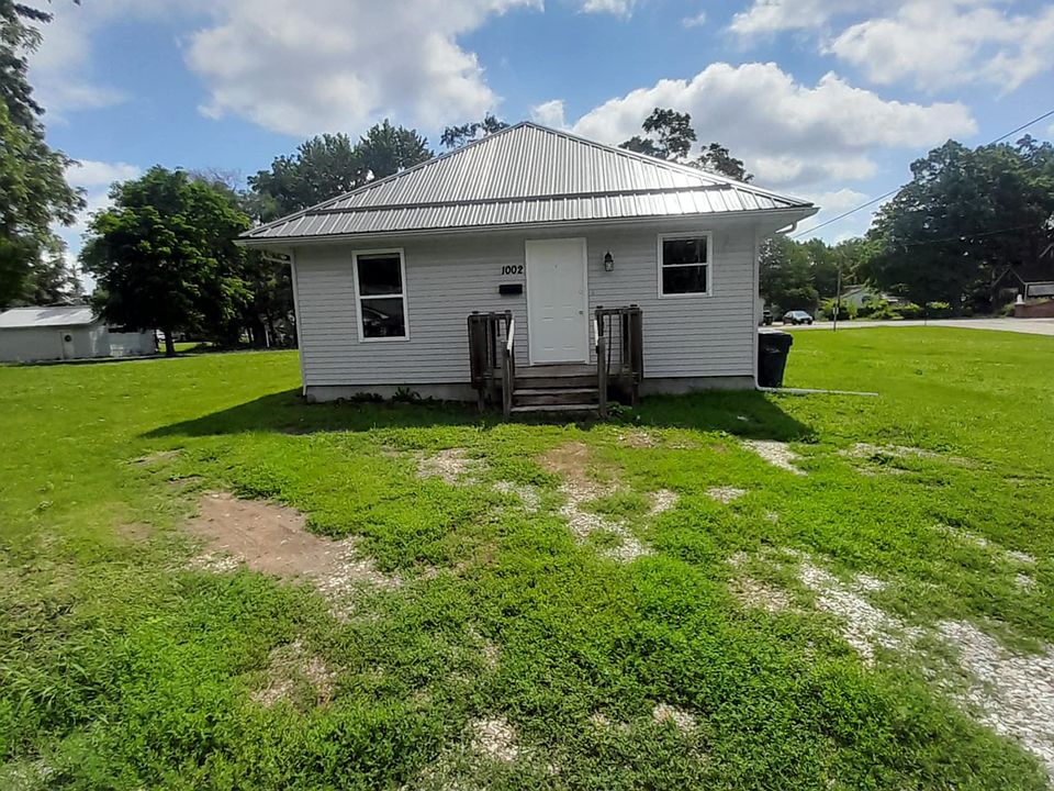 Front View of home featuring the two parking spaces.