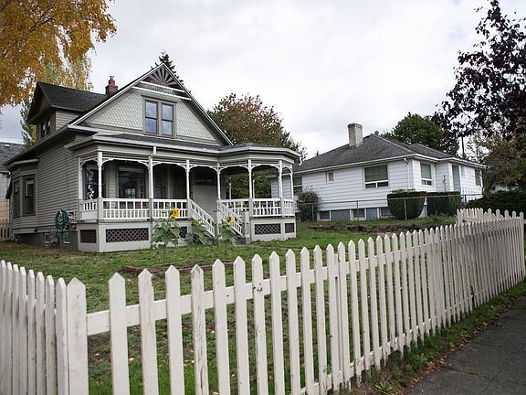 Front of the house with large fenced in yard.