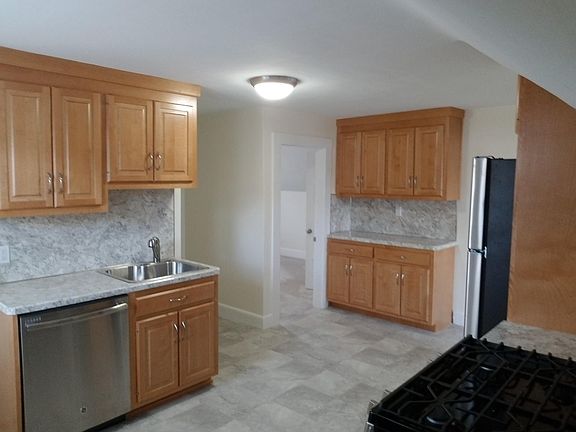 Kitchen showing extra cabinetry across room for more storage