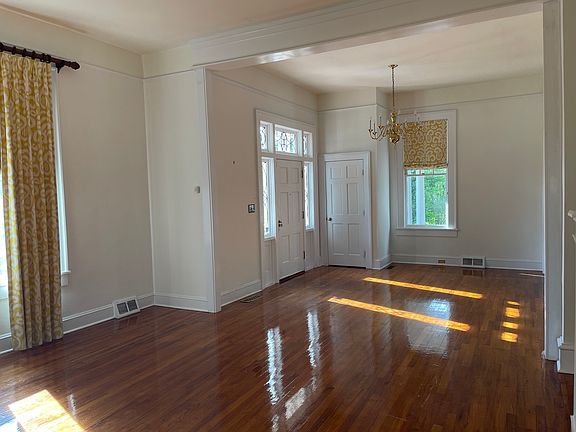 Entryway opening to living room to the right