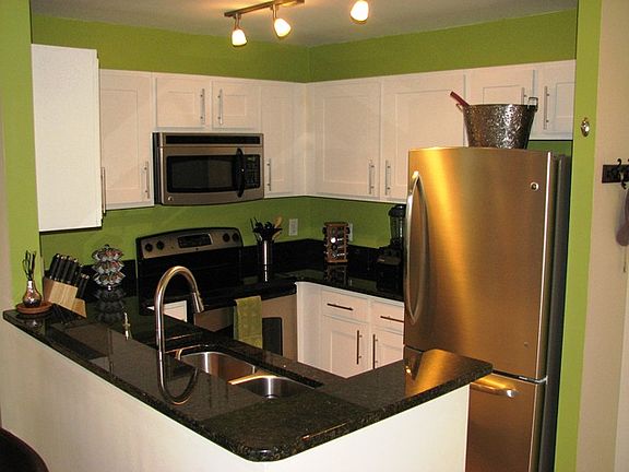 Renovated kitchen with new white shaker style cabinets, granite counters and new stainless appliances.