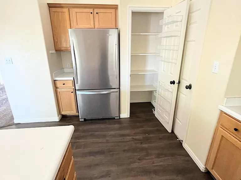 The kitchen is equipped with modern appliances making it both functional and inviting.