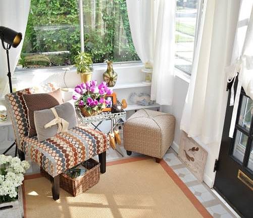Relax and enjoy this adorable front porch area.