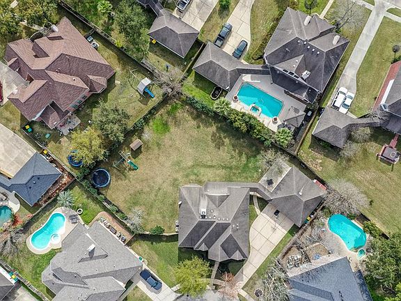 The center of this photo shows the amazing oversized backyard! The home sits on over 17,000 square feet of yard with so many endless outdoor possibilities!