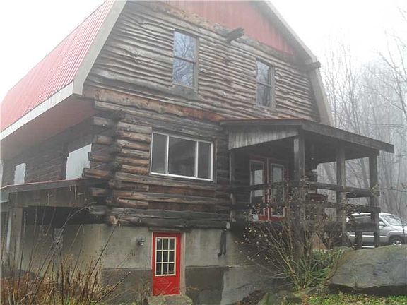 Exterior Back. Rear with covered porch for those quite evenings
