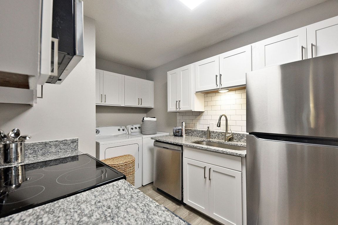 Kitchen with granite counters and stainless appliances