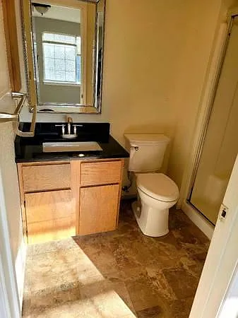 Second Bathroom with Mocha Italian Marble Floor and Shower Connected to Bedroom #1.