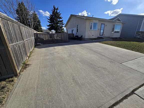 Gated access to backyard and concrete Parking pad (1 spot available + street parking)
