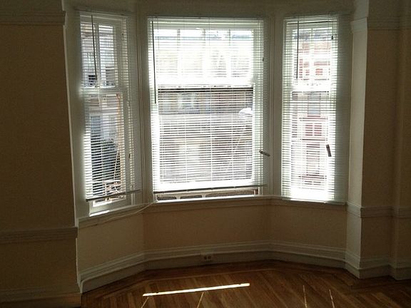 Large living room area with bay window