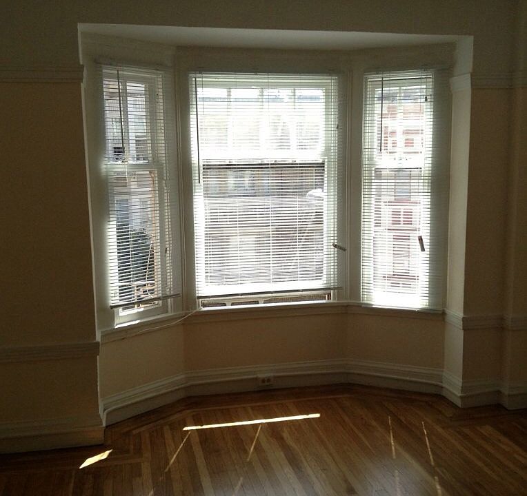 Large living room area with bay window