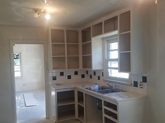 Kitchen bottom cabinets have drawers and cabinet fronts, picture taken during work