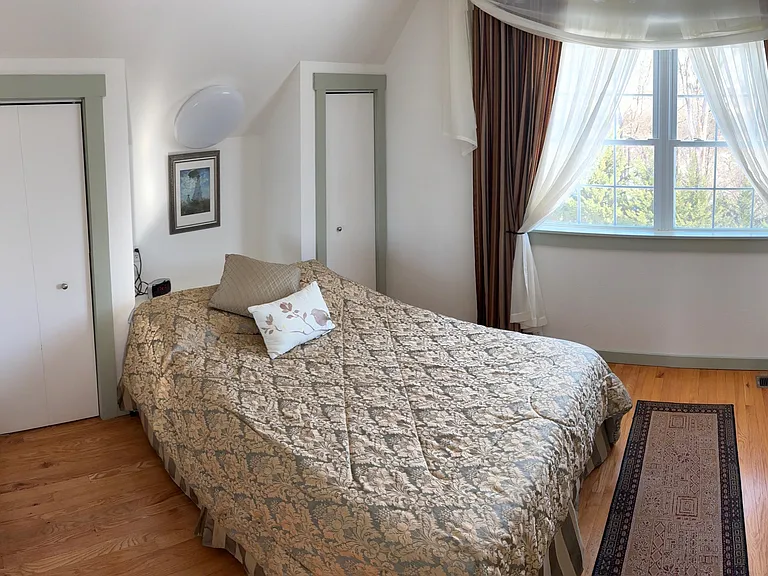 It has a full bed with plenty of closet space, and the view from the window of the backyard and woods.