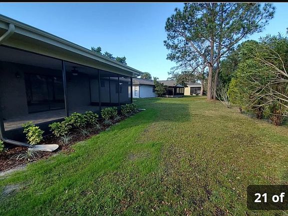 Back of yard with lanai