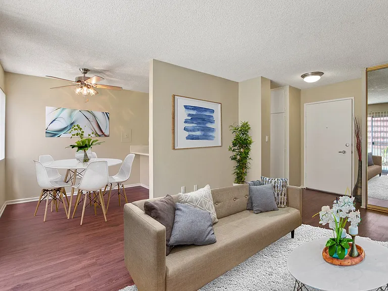 Living room and dining area with wood-style floors throughout