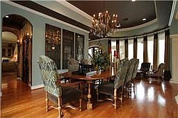 Formal dining room with full views of pool and offers hard wood floors.