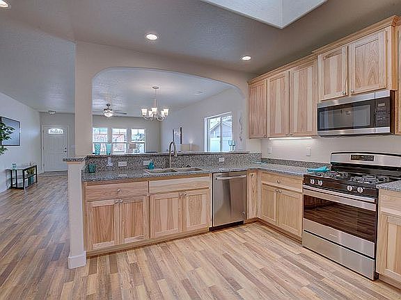 Kitchen through arch to greatroom
