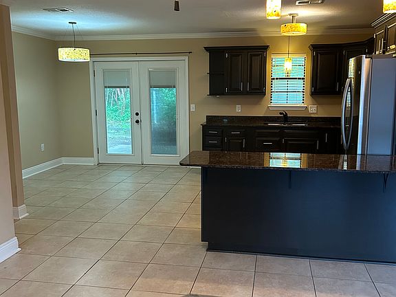 French doors leading to back patio