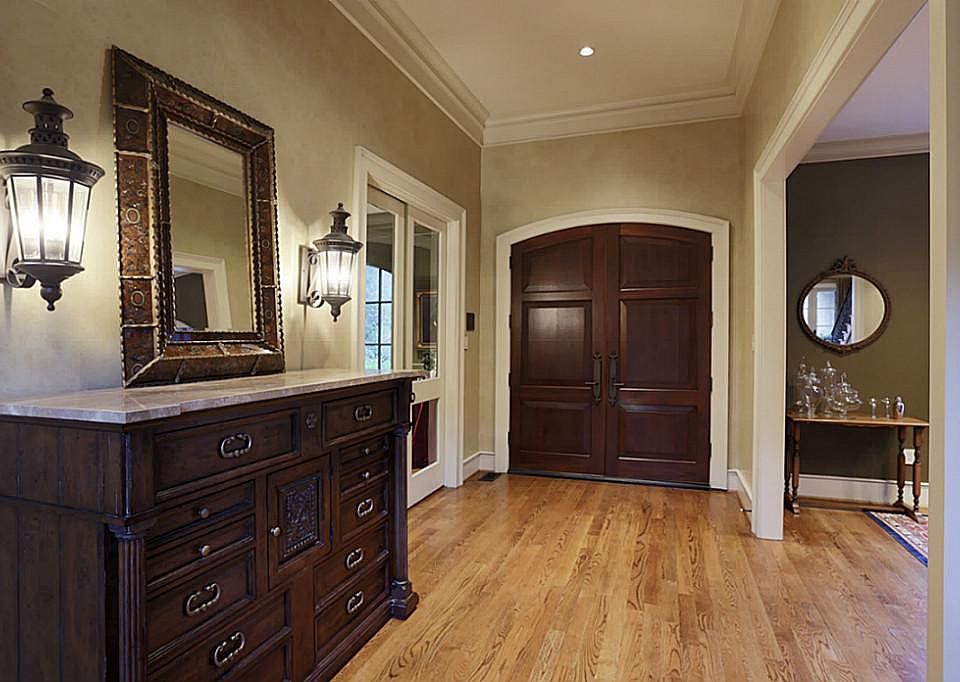 Impressive entry opens to study & formal dining.Hardwoods in all rooms except baths & laundry which 