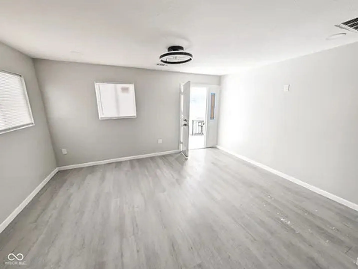 This newly updated single-family home in Indianapolis, IN. This two-bedroom, one-bath residence o... — Photo 2
