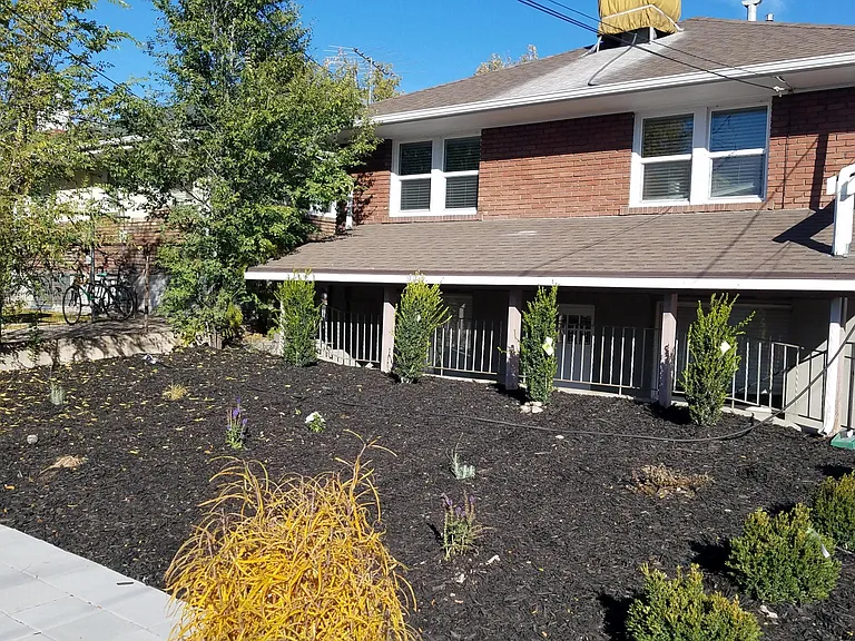 Backyard facing entrance to apartment