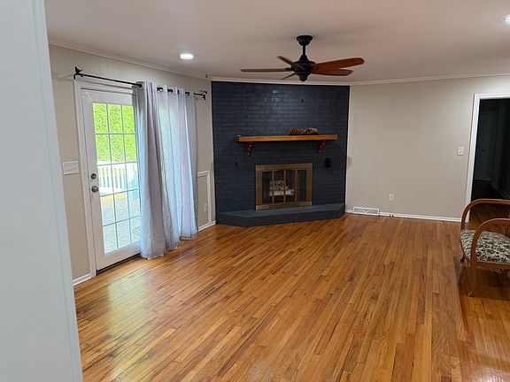 bonus family room with gas fireplace and french doors leading to back patio