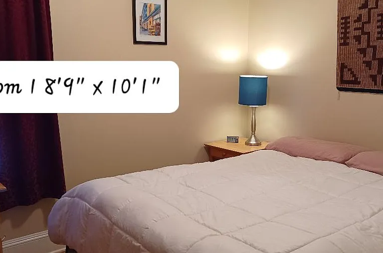 This cozy bedroom has a queen bed, large dresser and two bedside tables. Room darken shade and heavy drapes. All bedrooms have typical closets.