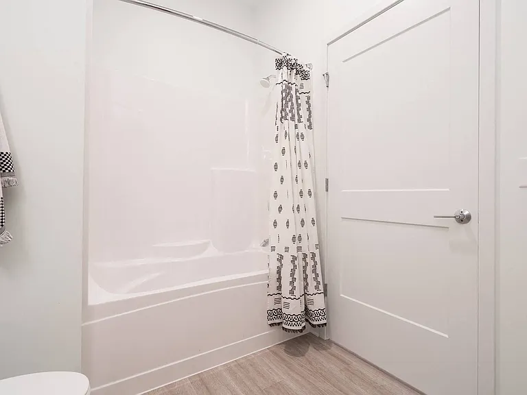 Bright and airy bathrooms feature modern finishes and plenty of space.