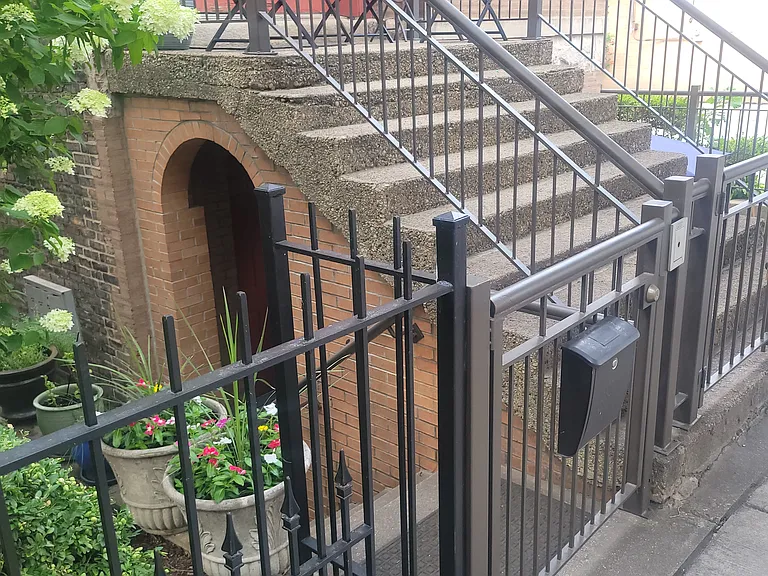 Locked gate to gangway and garden unit.