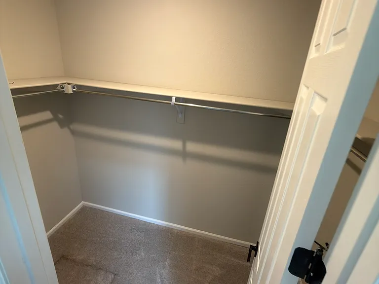Primary closet with crawl space