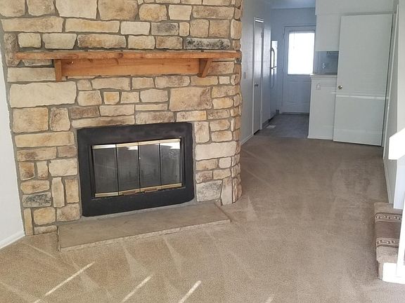 Front room with wood fire place - view from front door - Main level