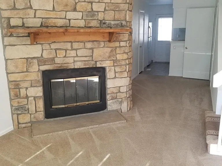 Front room with wood fire place - view from front door - Main level