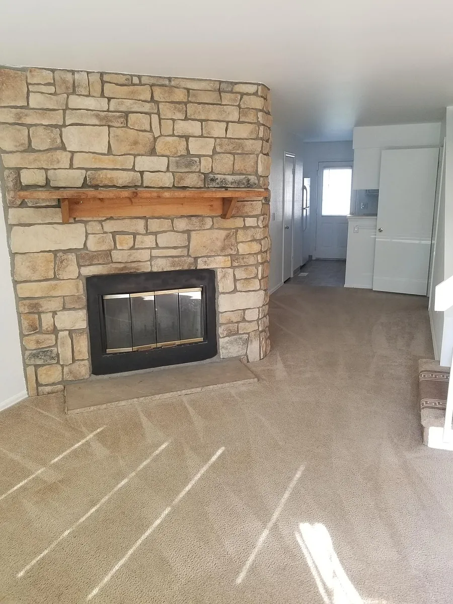 Front room with wood fire place - view from front door - Main level - 10843 Summerset Way