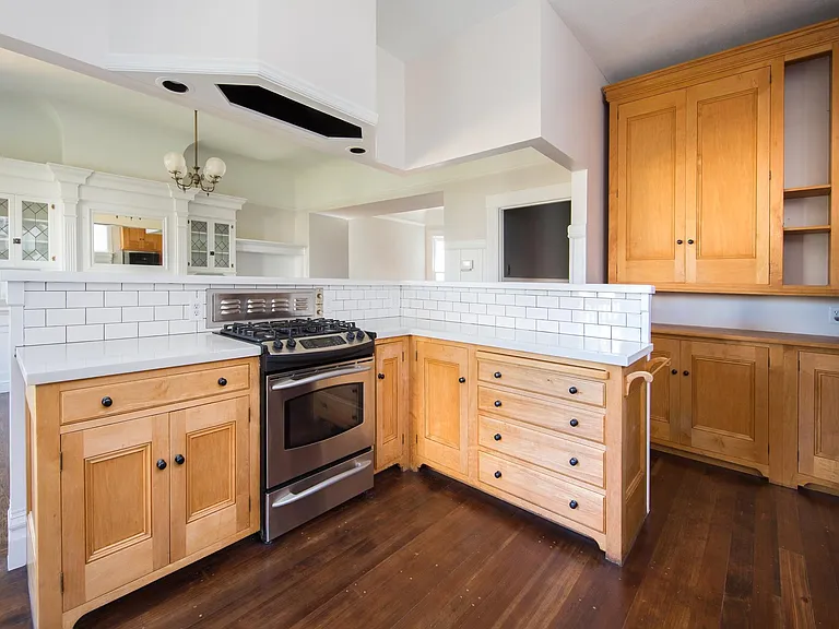 Kitchen -- see next photo for view into great room. Birds-eye maple cabinetry and new appliances.