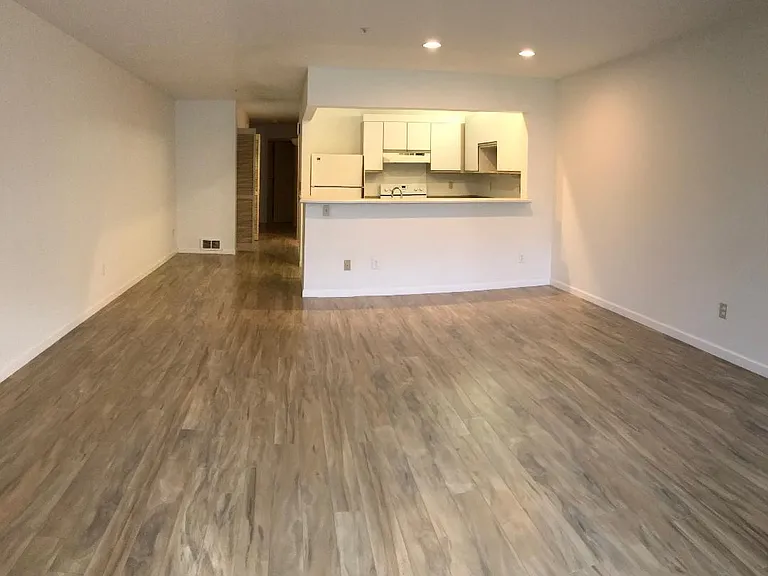 From sliding patio door looking into living room and kitchen beyond.