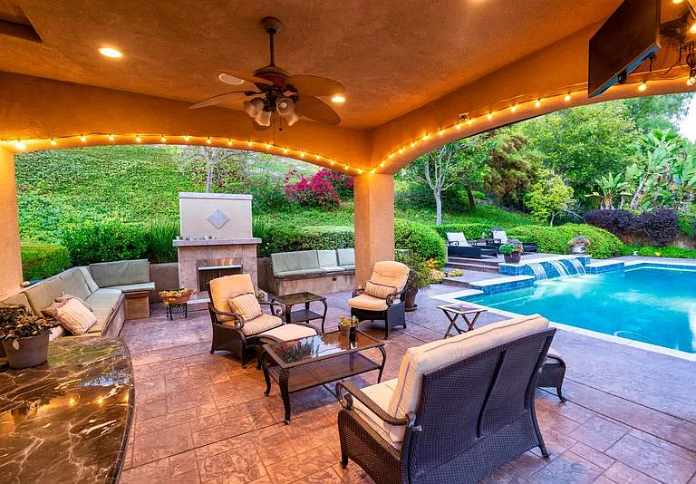 Huge pergola with furniture for either conversation or dining for a 12 guests.