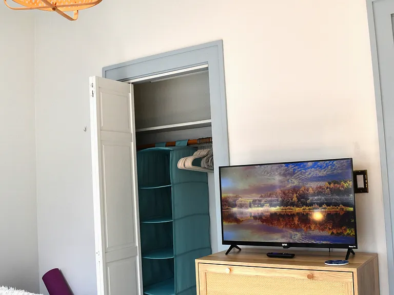 Closet is small, but has shelving, shoe hanger, and plenty of hangers