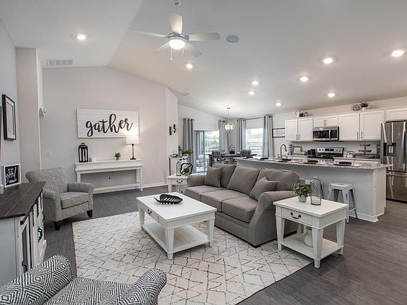 Open and spacious gathering room- New home for sale in Lakelan, FL. Photo showcases the home layout