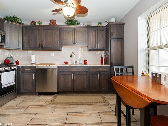 Totally updated kitchen with new cabinets, countertop, flooring and all SS appliances.