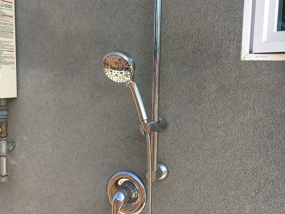 Outdoor shower at entry to path from street